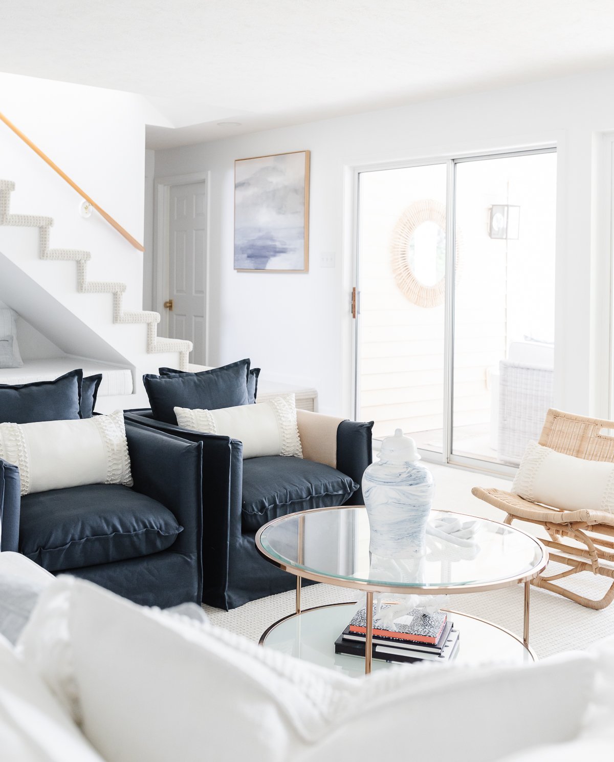 A navy and white modern coastal living room.