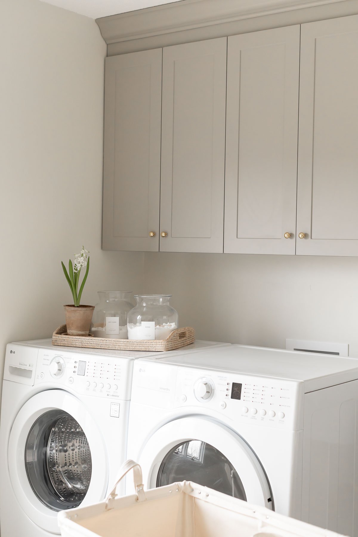 An organized laundry room equipped with a washer and dryer.