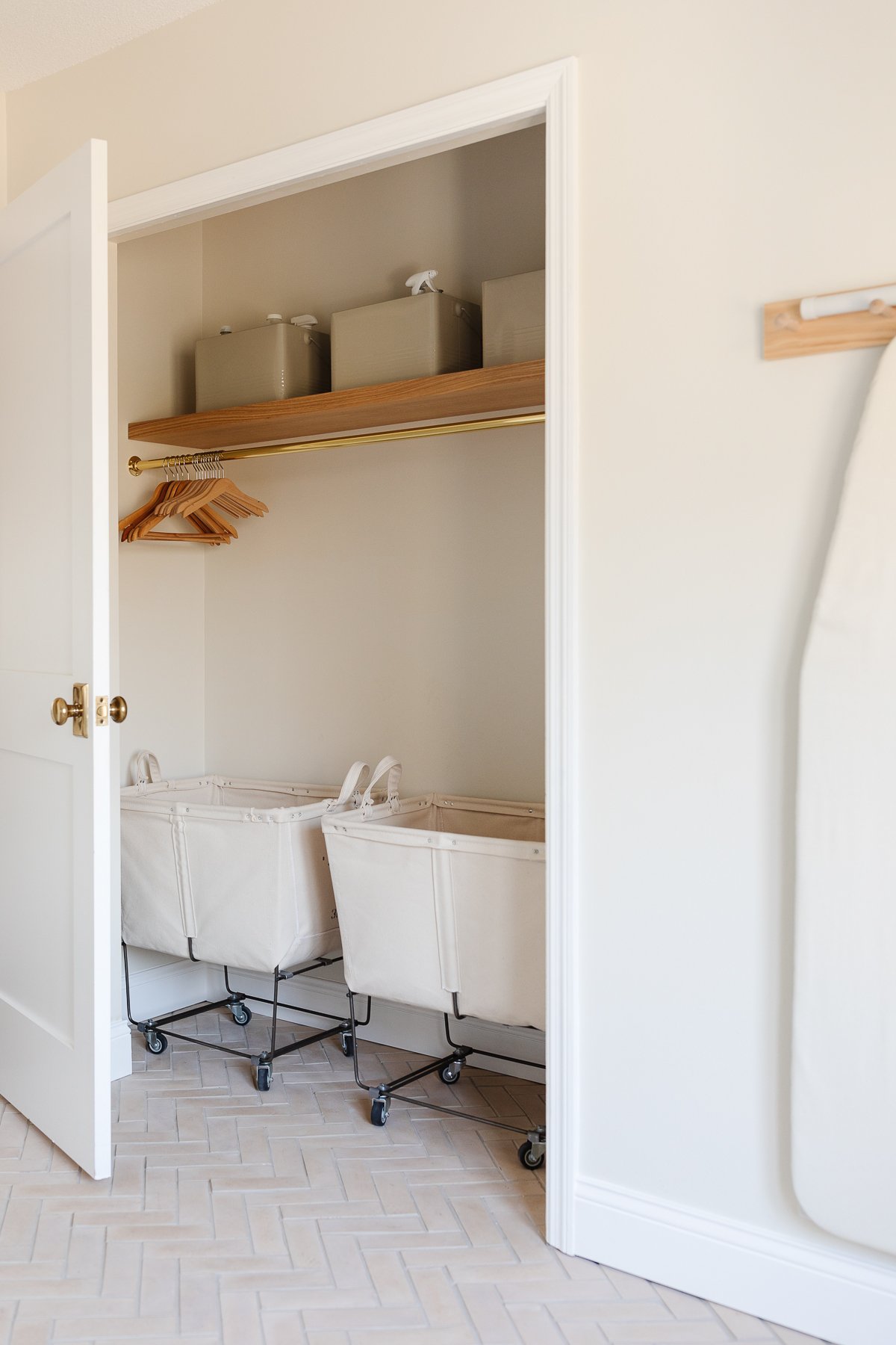 A laundry room with baskets for laundry room organization.