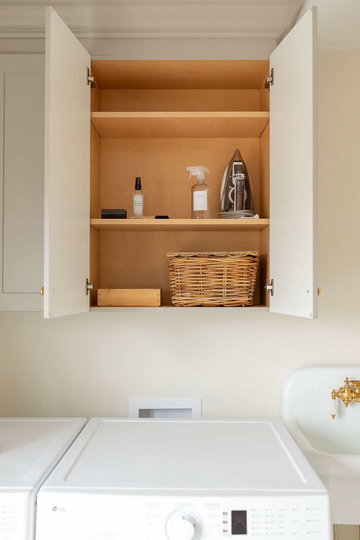 An organized laundry room equipped with a washer and dryer.