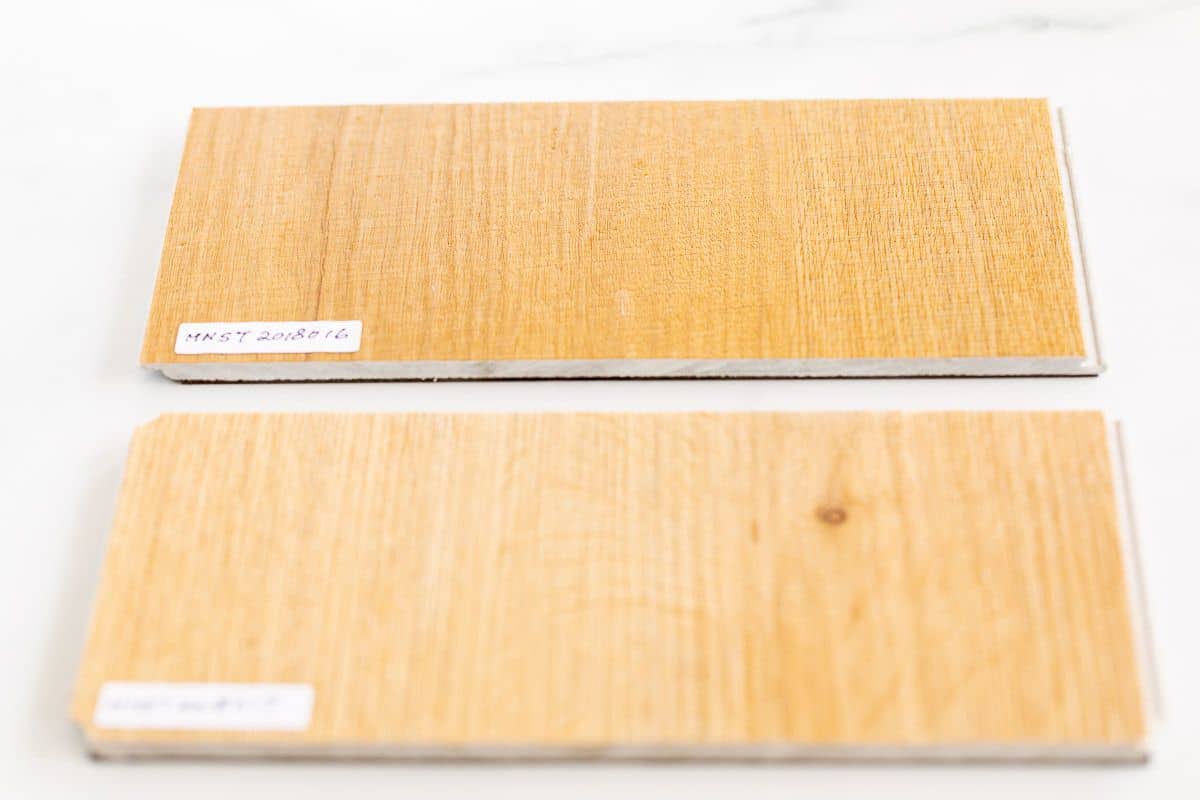 Small samples of the best vinyl plank flooring laid out on a white surface.