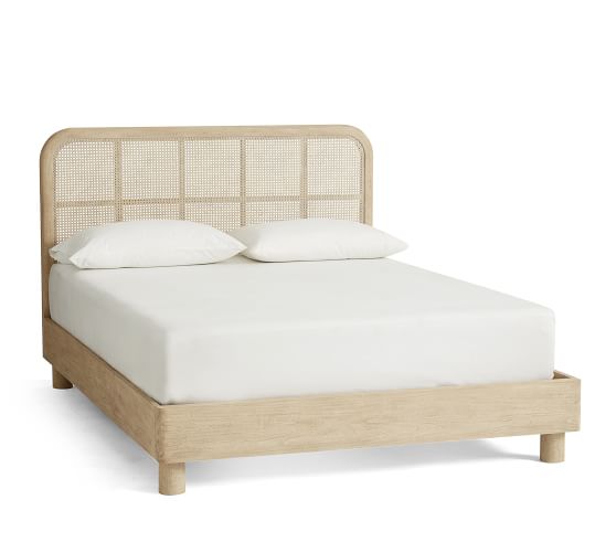 A rattan bed with a white background.