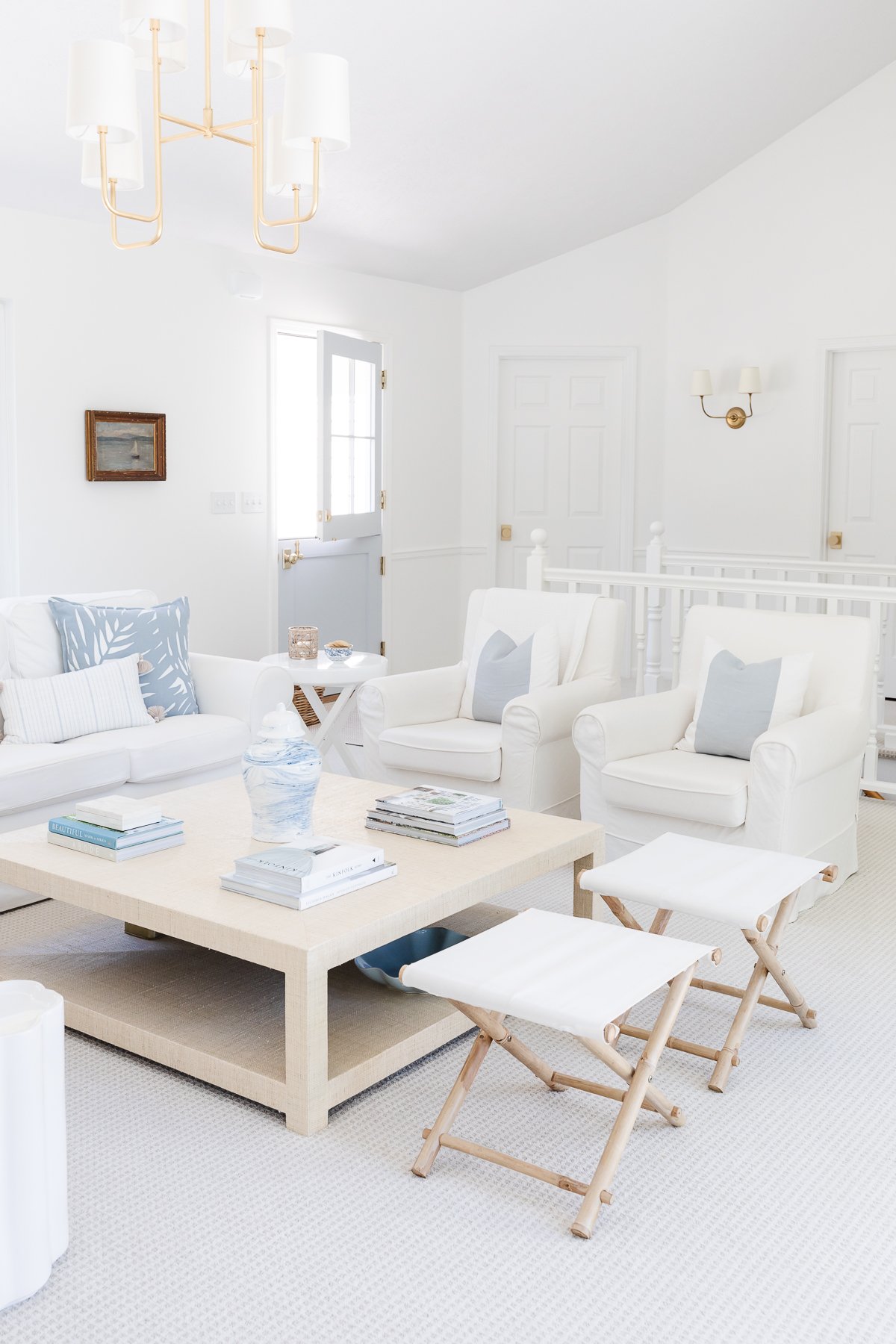 A blue and white modern coastal living room. 