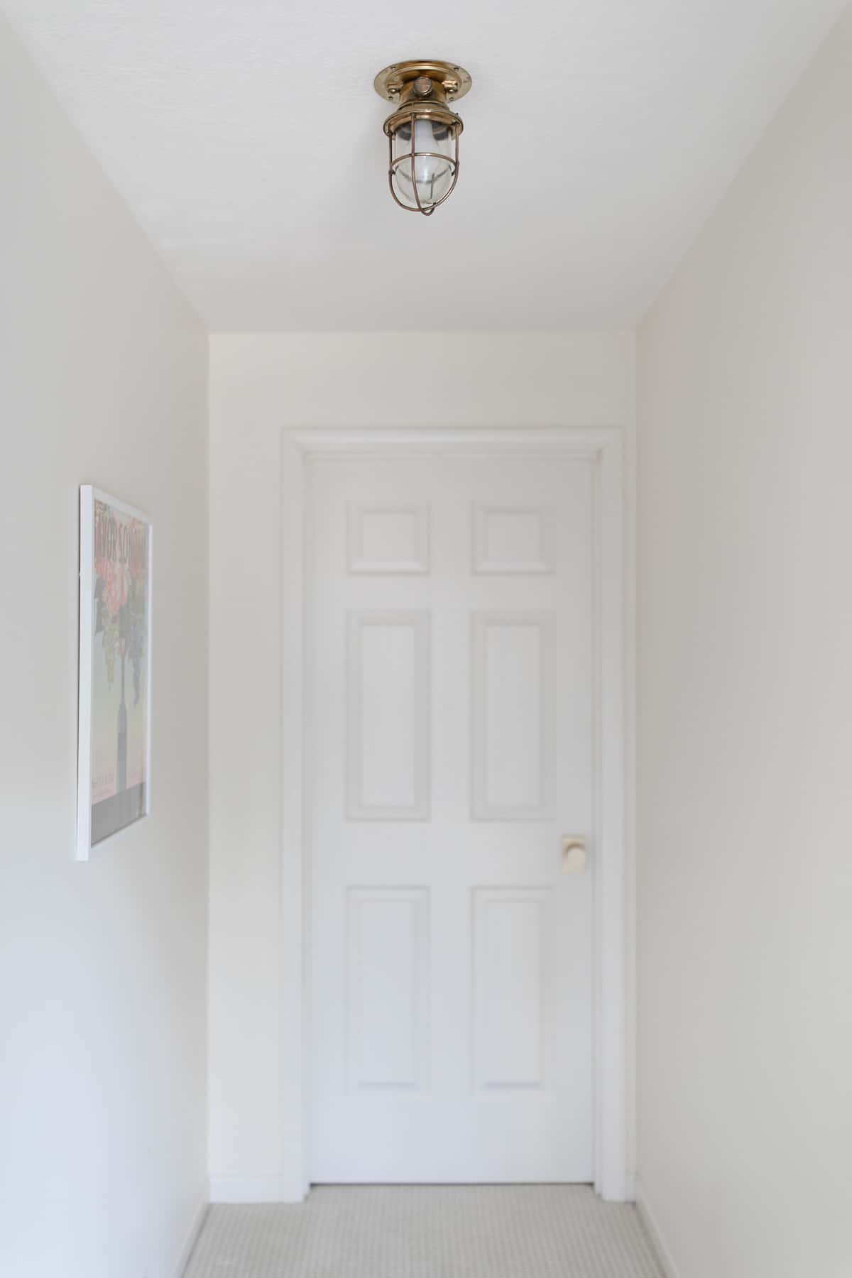brass nautical light in hall