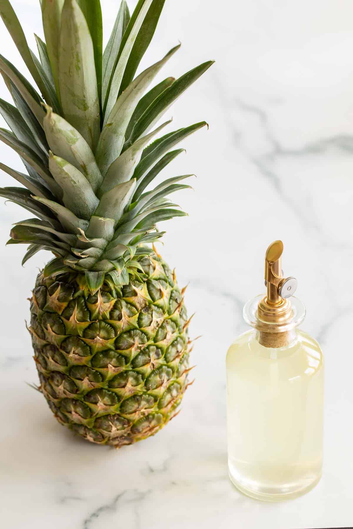 pineapple simple syrup next to pineapple