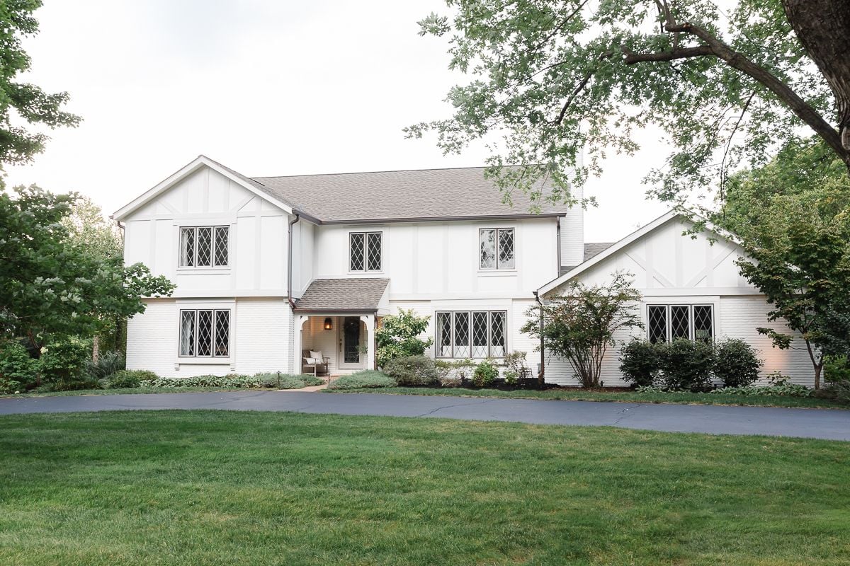 A vintage 70s tudor home, with soft cream and greige tudor paint colors.