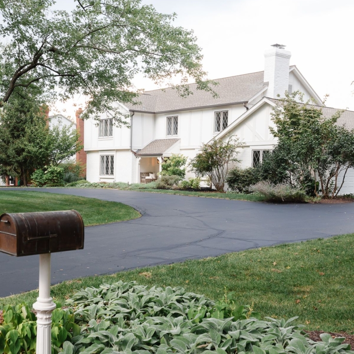 A vintage 70s tudor home, with soft cream and greige tudor paint colors.