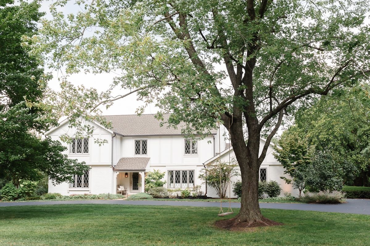 A vintage 70s tudor home, with soft cream and greige tudor paint colors.