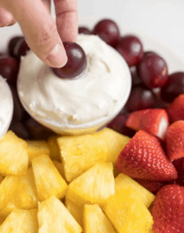 cream cheese fruit dip surrounded by fresh fruit.