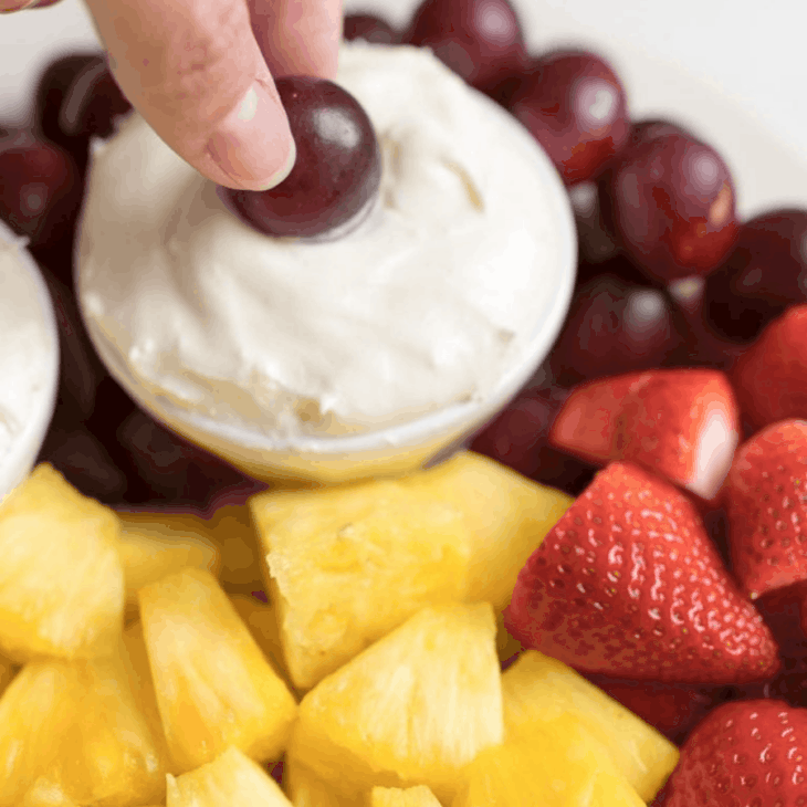 cream cheese fruit dip surrounded by fresh fruit.