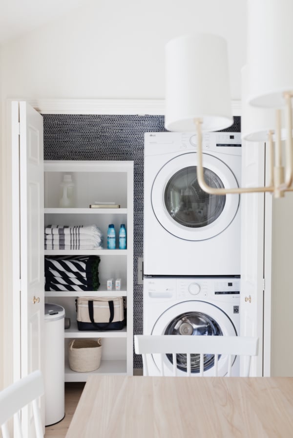 A laundry closet with a washer and dryer.