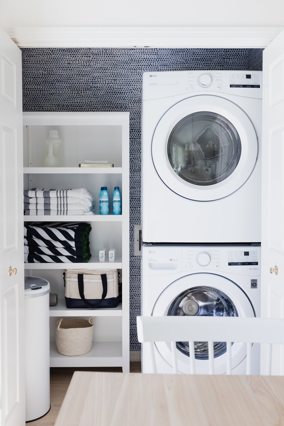 A laundry room with a washer and dryer, ideally designed as a laundry closet.