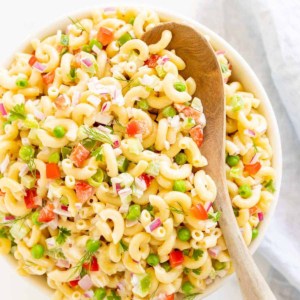 macaroni salad with wood serving spoon
