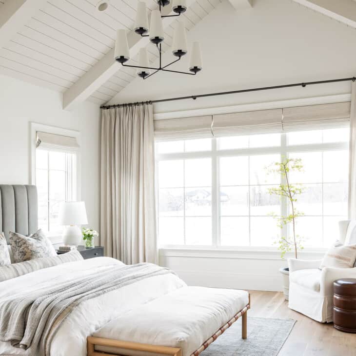bedroom with vaulted ceilings painted in benjamin moore swiss coffee