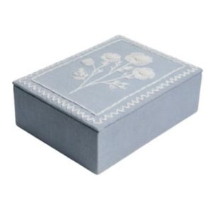 Rectangular light blue box with a white floral design and zigzag border on the lid, perfect as charming bookshelf decor.