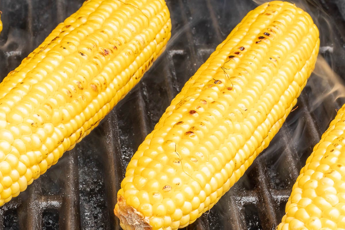 Corn on the cob on a grill.