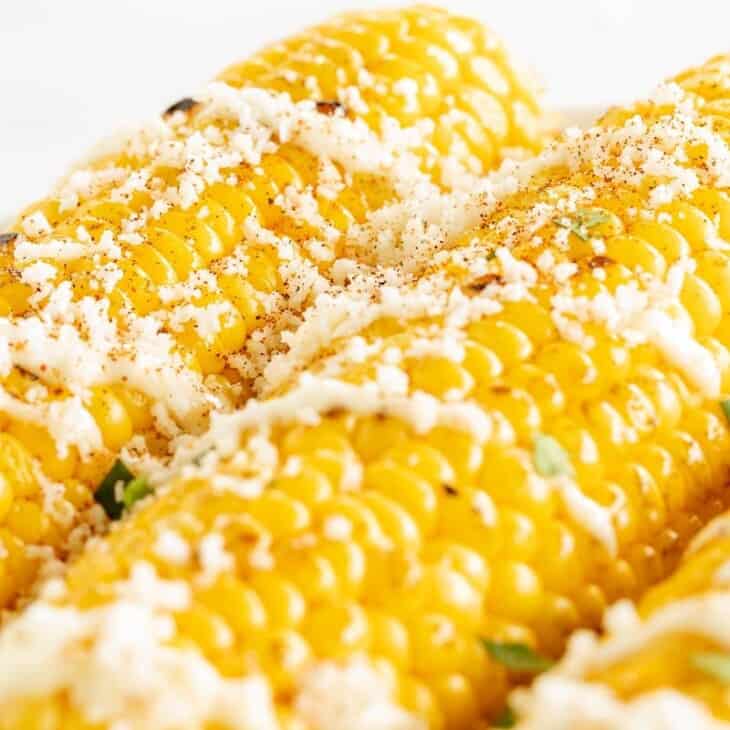 Grilled corn on the cob, topped with everything but the elote seasoning.