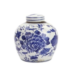 A ceramic ginger jar with a lid, decorated with blue floral patterns on a white background—perfect as elegant bookshelf decor.
