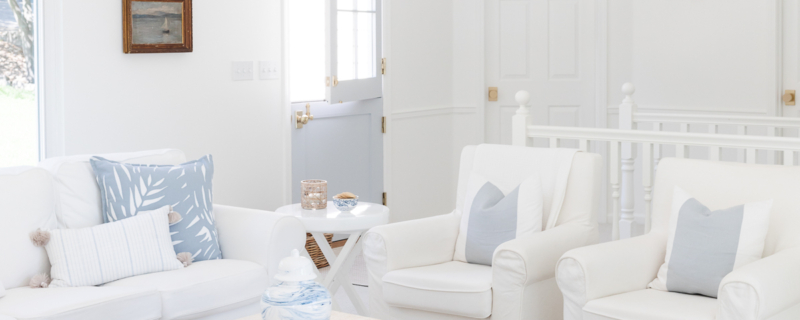 A white living room filled with luxury home decor