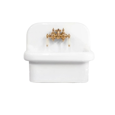 a white ceramic wall mounted sink with brass hardware
