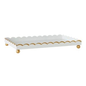 A white rectangular tray with scalloped edges, gold trim, and four round gold feet—an elegant choice for bookshelf decor.