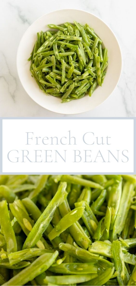 On a marble counter top there is a round white bowl of french cut green beans!