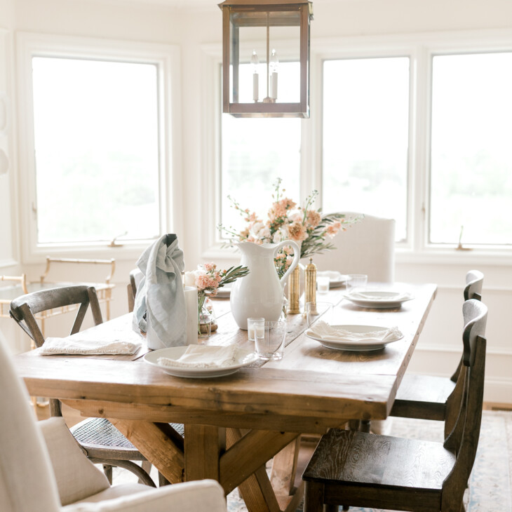 breakfast room with wood table and brass light