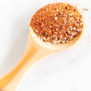 small wooden spoon full of the best burger seasoning