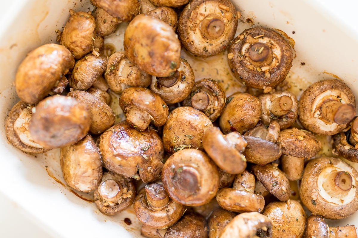 roasted mushrooms in a white baking dish