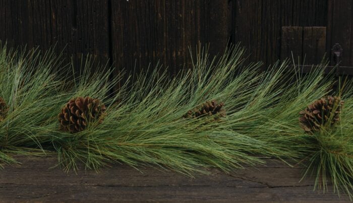 artificial pine garland with pine cones