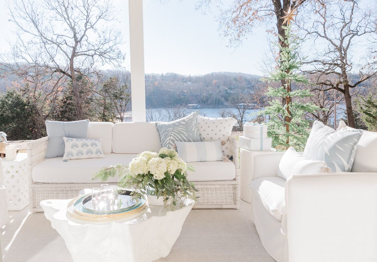 White serena and lily outdoor furniture on a lakefront patio