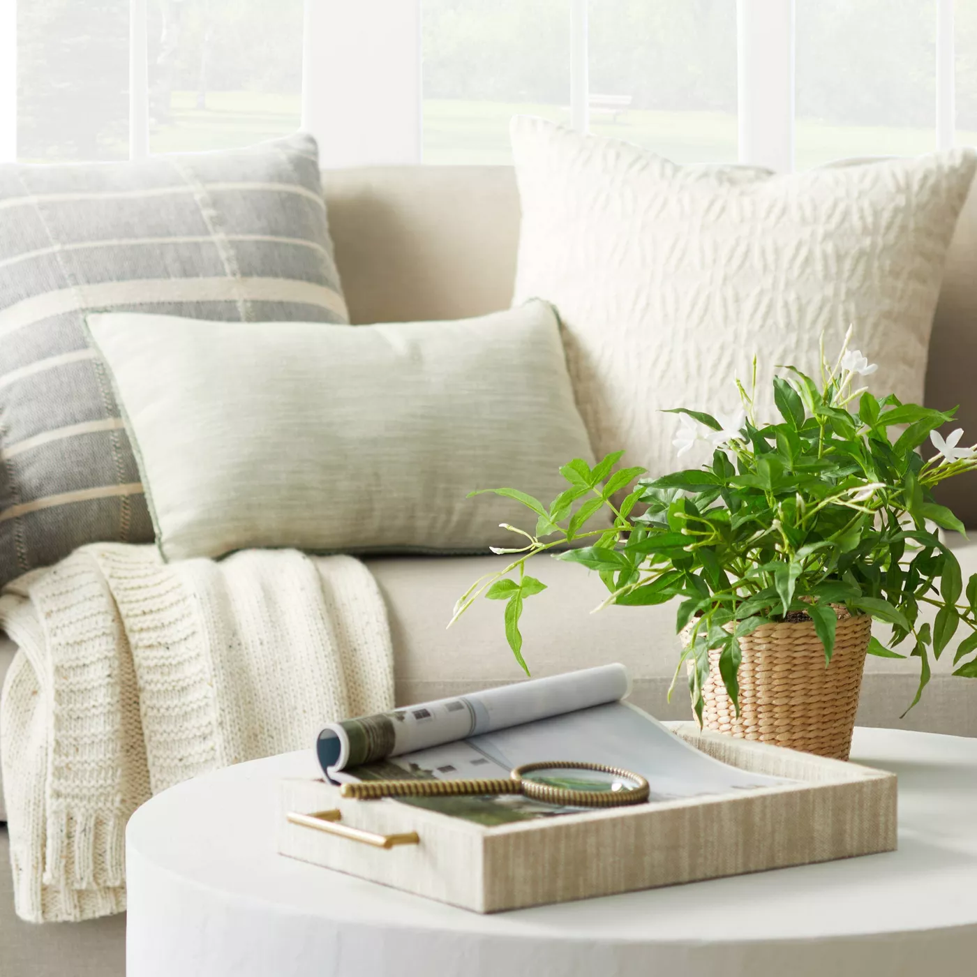A sofa and coffee table styled for spring with Studio McGee Target 