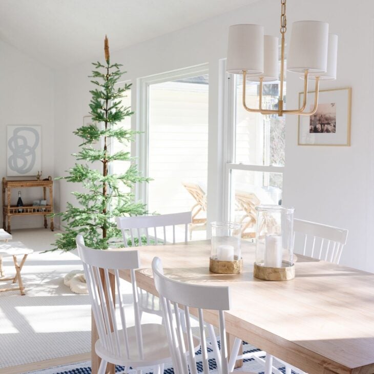 A home painted in Chantilly Lace from Benjamin Moore, Christmas tree in the living room