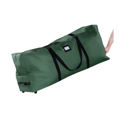 A person holding a large green duffel bag, perfect for Christmas storage.