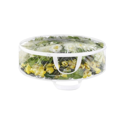 A plastic container filled with vegetables and flowers, ideal for Christmas storage.