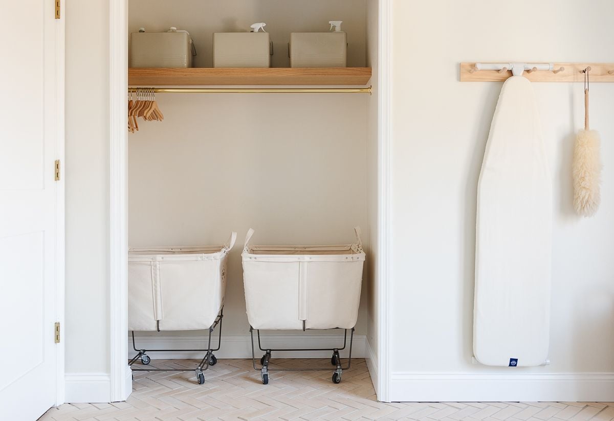 A laundry room with a decluttered closet