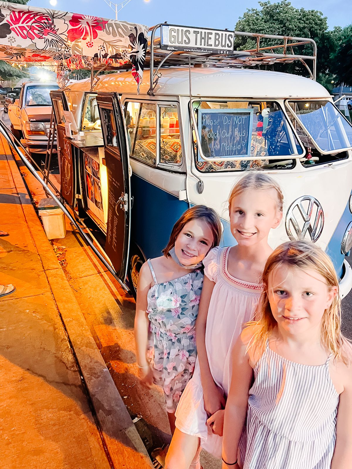 Three little girls in front of a VW shave ice truck in Maui