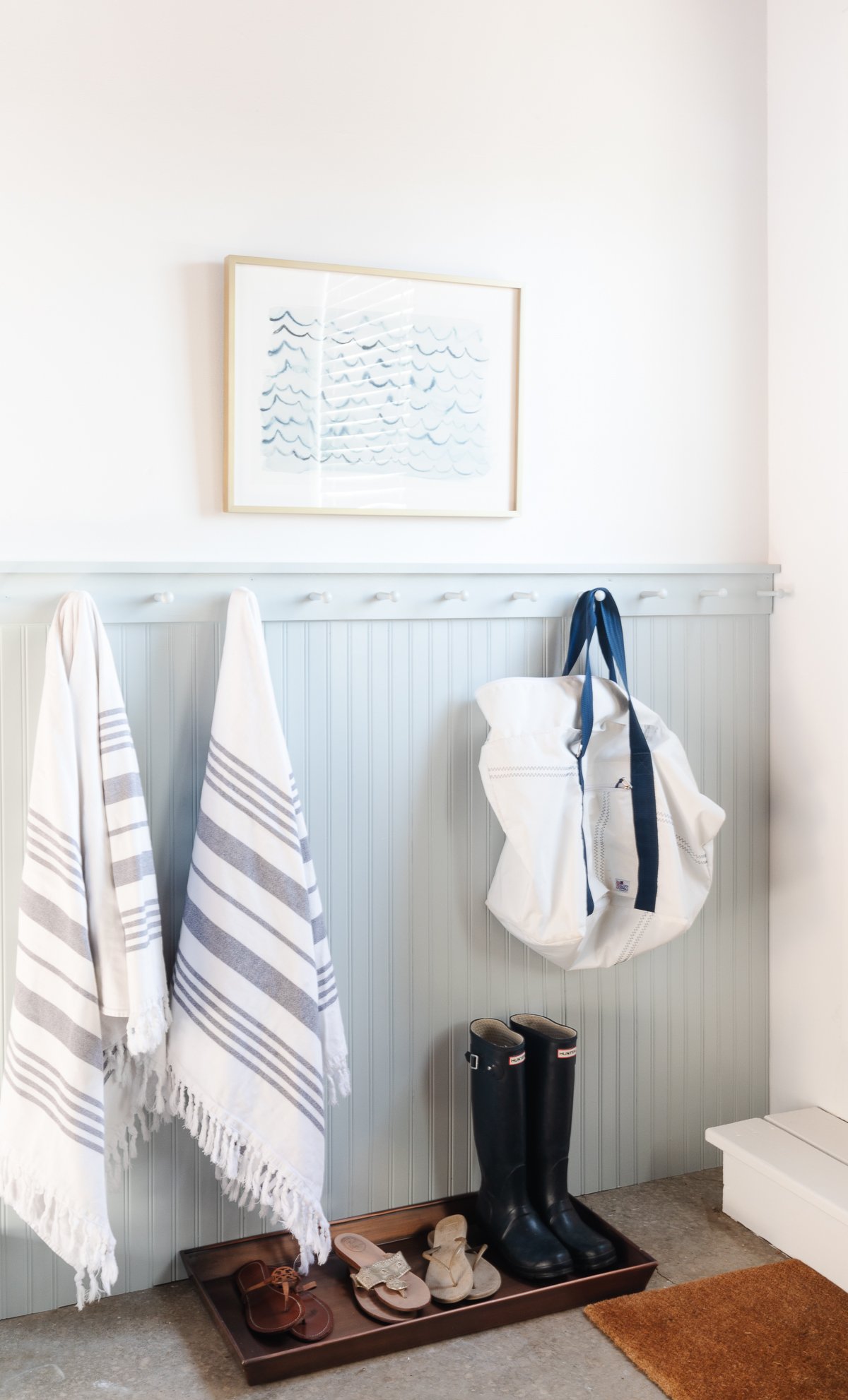 towels and bags on peg rail