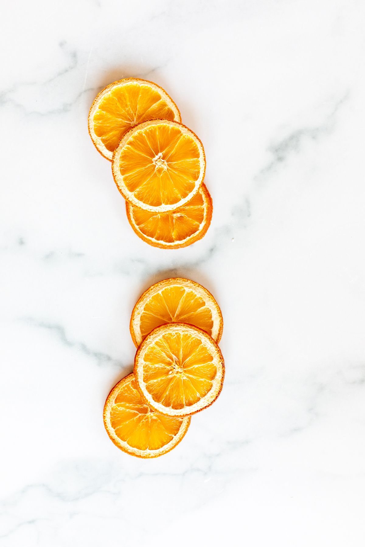 Dried orange slices on a marble countertop