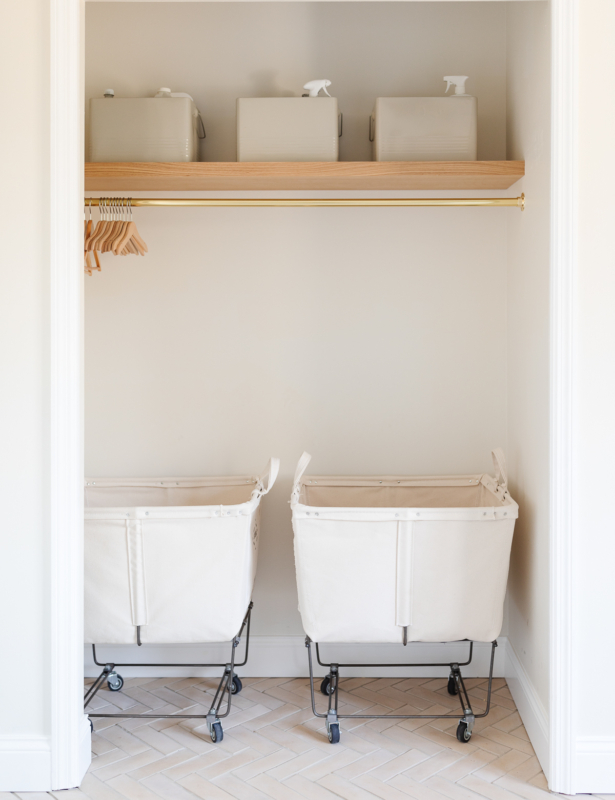 laundry carts and cleaning bins in closet