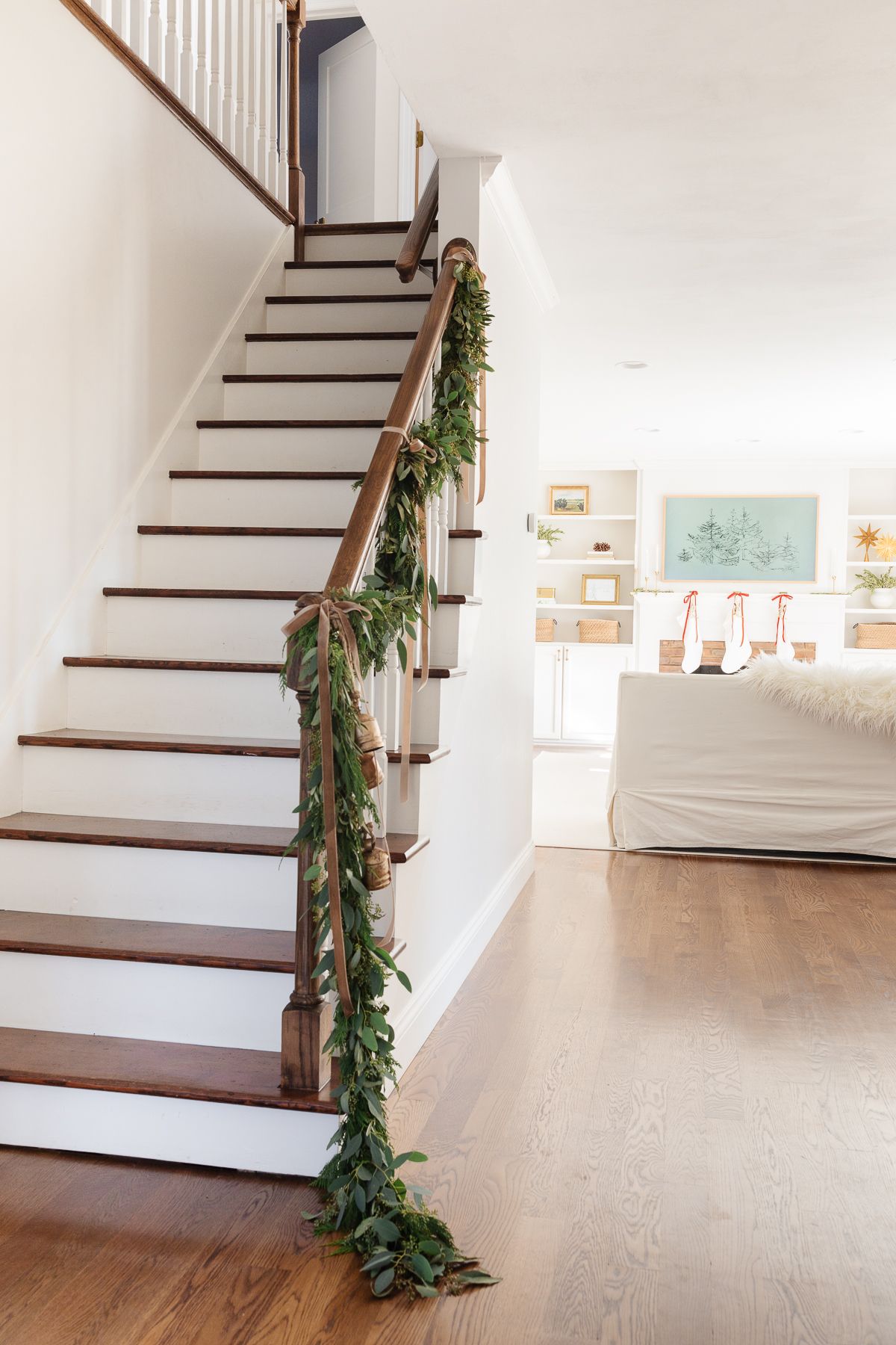 traditional Christmas decor of a garland on a staircase