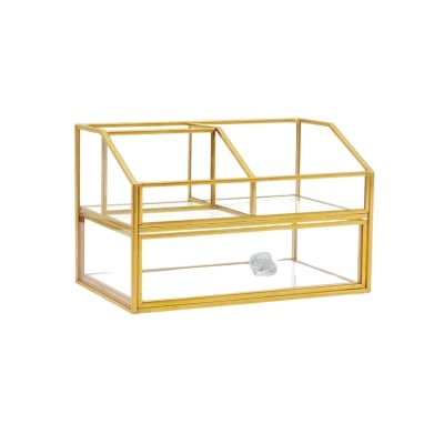 A gold bathroom display case with a glass top for bathroom organization.