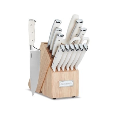 A wooden block containing a set of knives for kitchen counter organization.