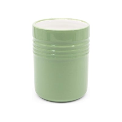 A ceramic mug on a white background, adding a touch of green to your kitchen counter organization.
