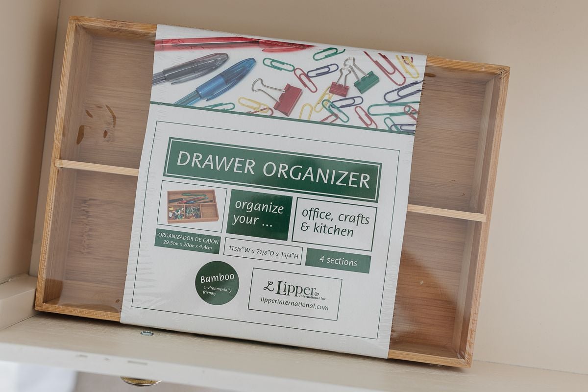 A bamboo drawer organizer in packaging