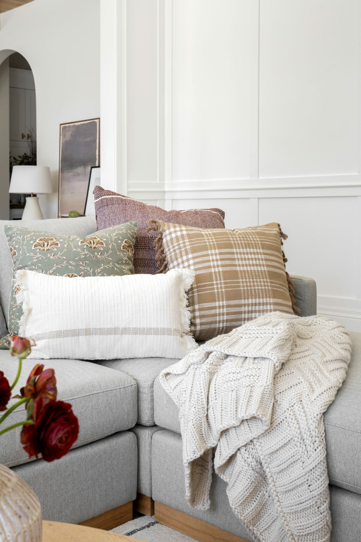 Studio Mcgee for Target pillows piled onto a sofa