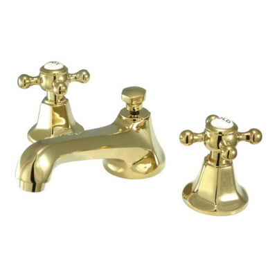 A pair of brass bathroom faucets.