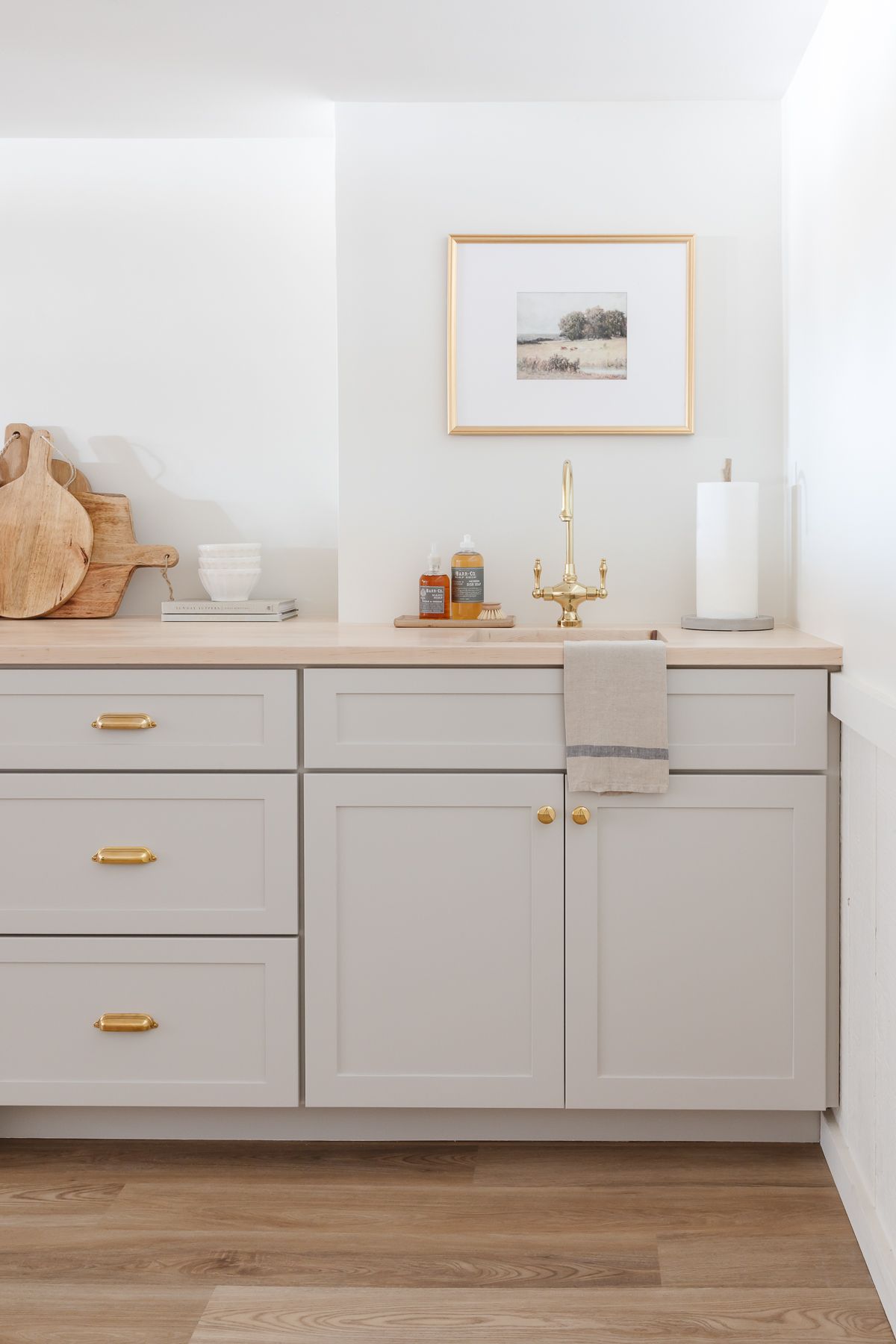 Butcher block countertops on a painted gray basement bar.