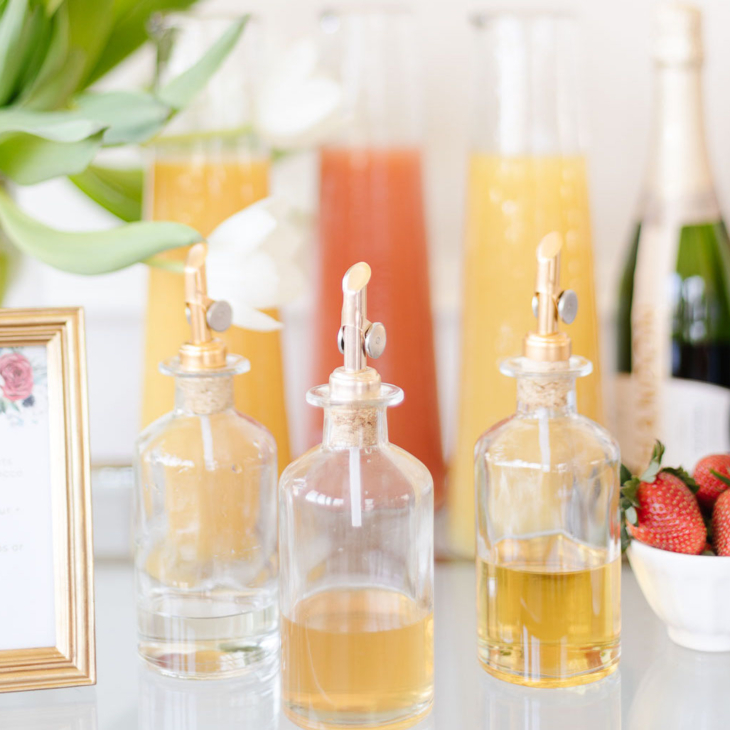 mimosa bar with juices, champagne and fruits