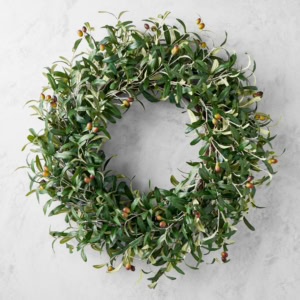 A spring-inspired olive wreath of lush green and brown leaves, accented with plump olives, rests elegantly against a light gray background.